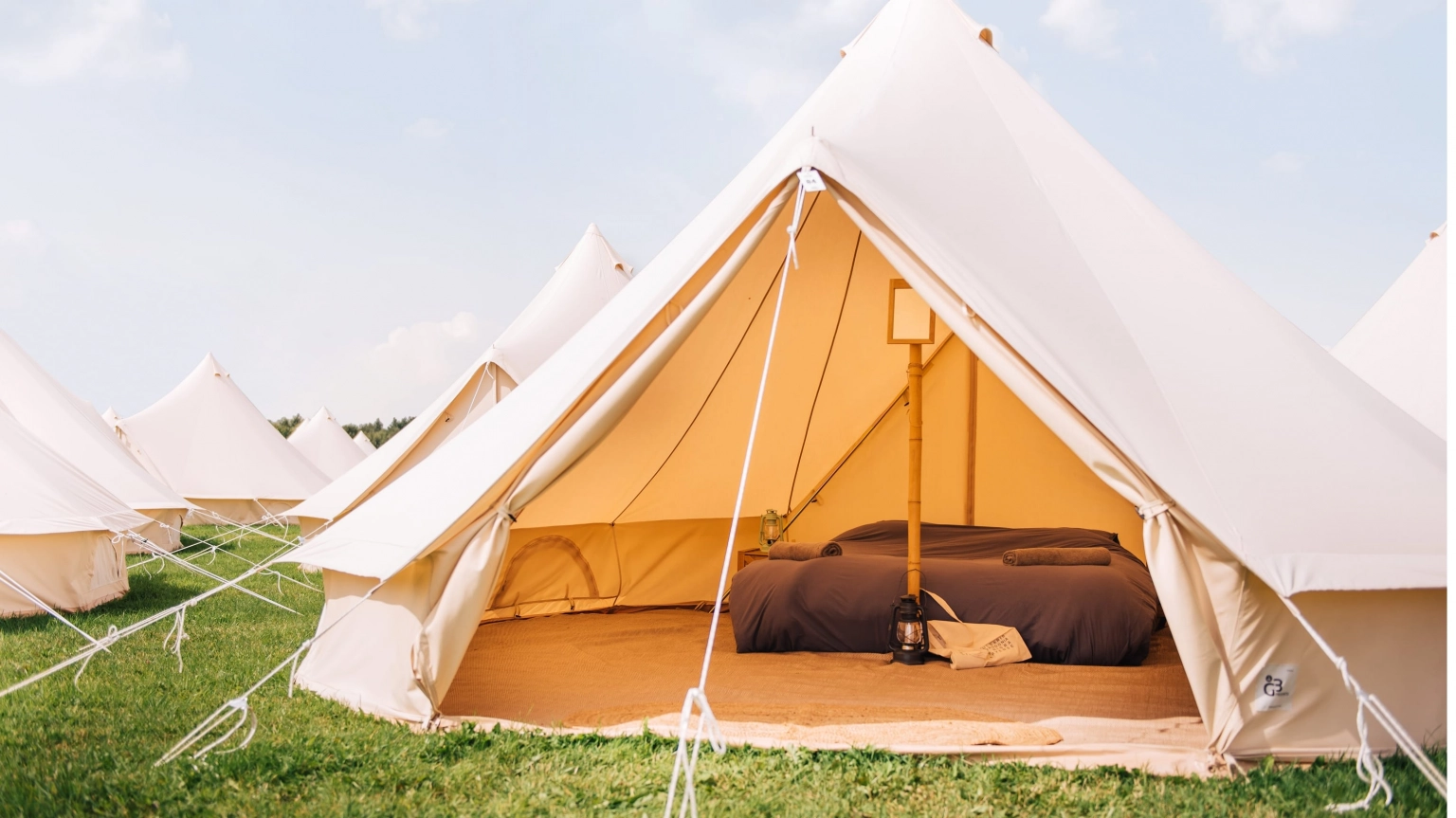 A photograph of the exterior of a boutique accommodation tent at Lost Village.