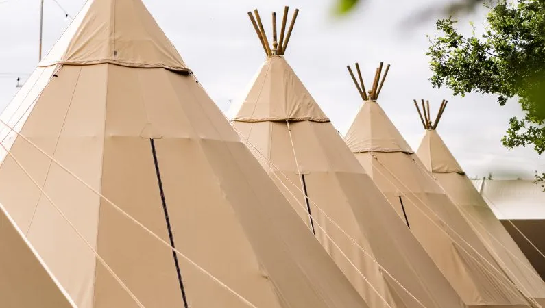 A photograph of tipis at Lost Village.