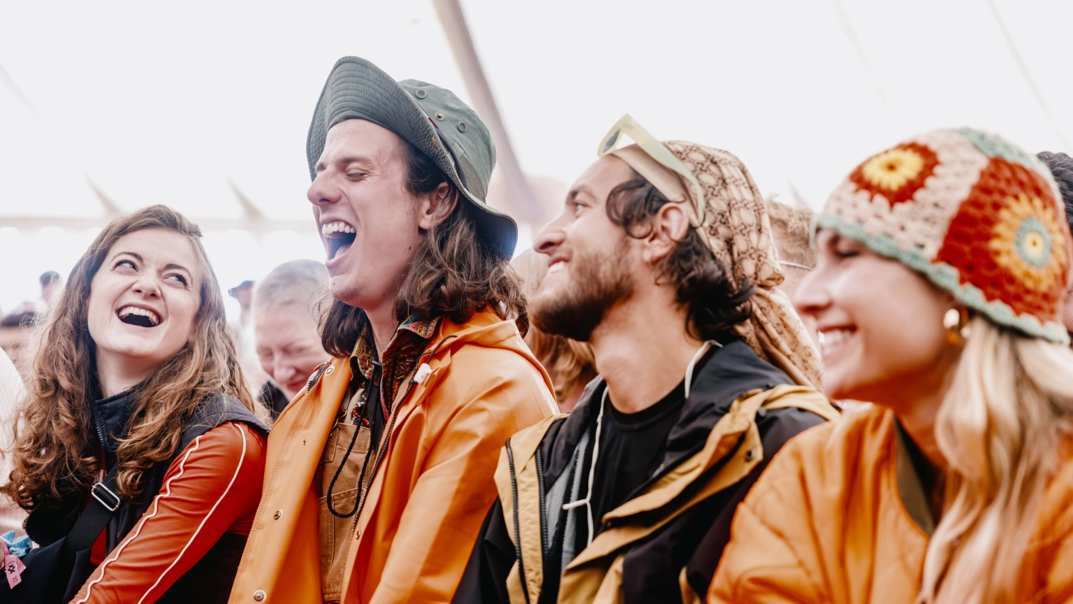 A photograph of people enjoying the comedy at Lost Village.
