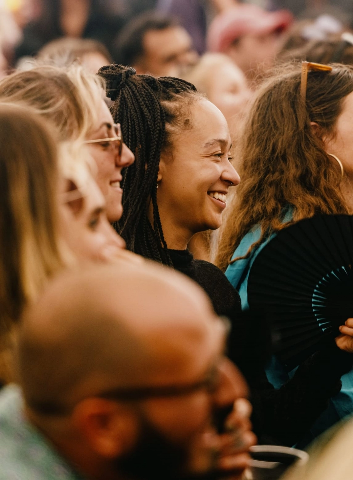 A photograph of people enjoying the comedy at Lost Village.