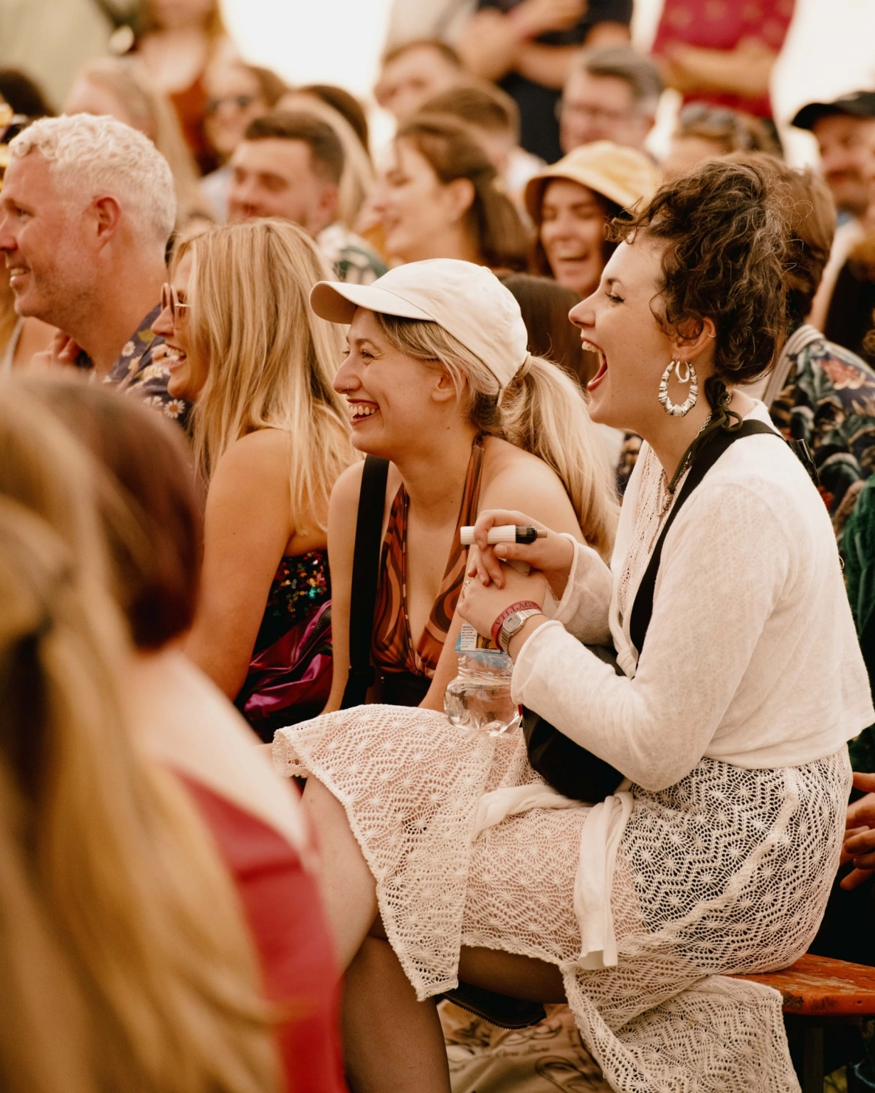 A photograph of a crowd laughing at the Lost Theatre at Lost Village.