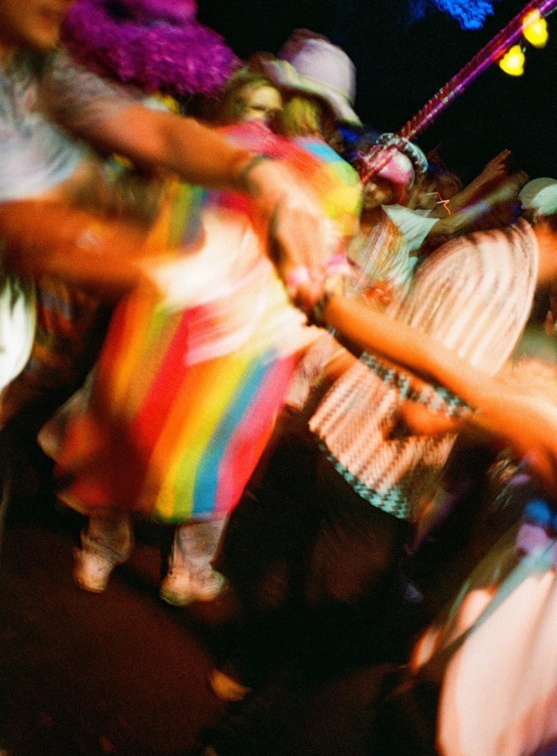 A blurred photograph of revellers at Lost Village.