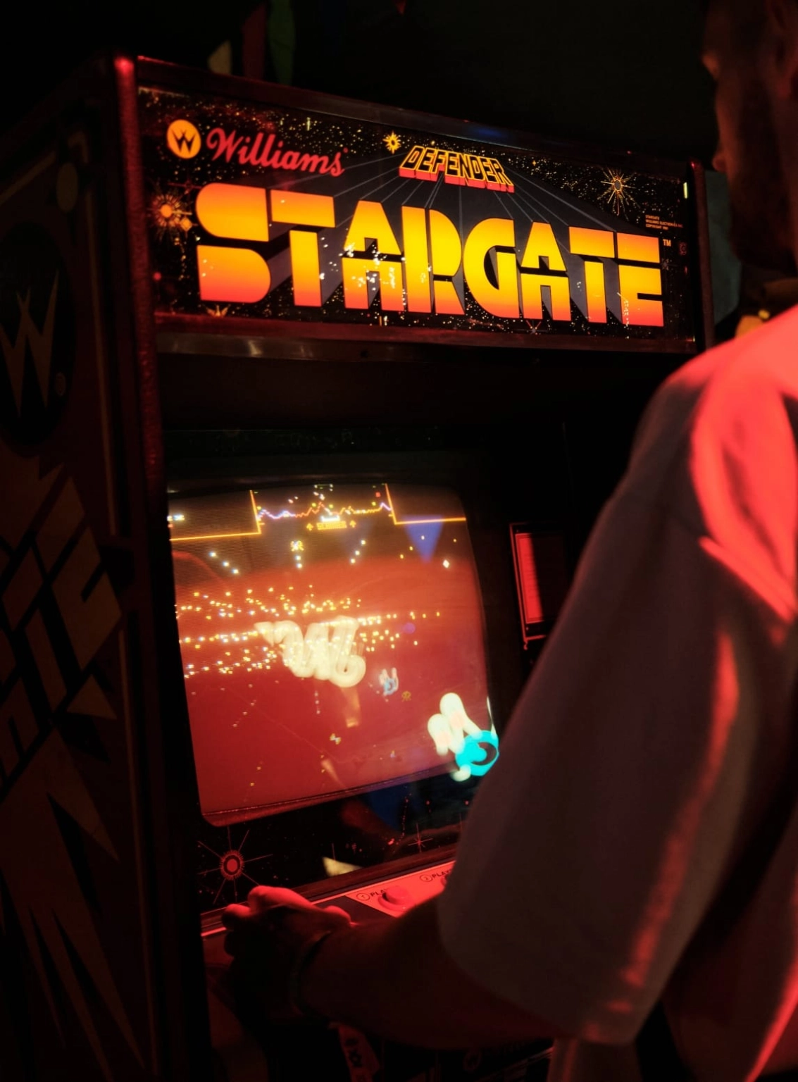 A photograph of a retro arcade game, Stargate, at Lost Village.