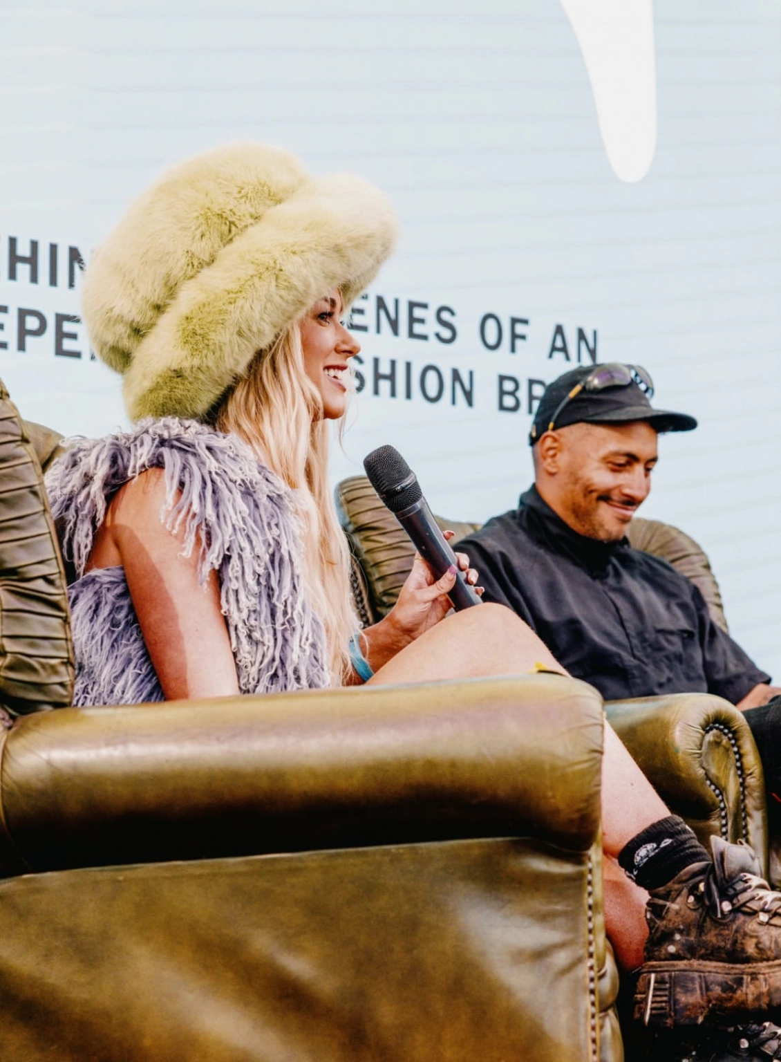 Two people sat in armchairs delivering one of the talks at the Institute of Curious Minds at Lost Village.