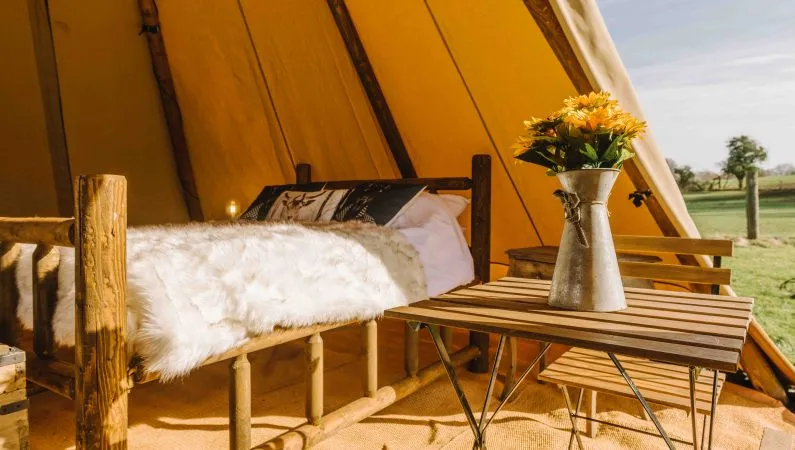 A photograph of the interior of the ultimate tipi, a premium accommodation option at Lost Village.