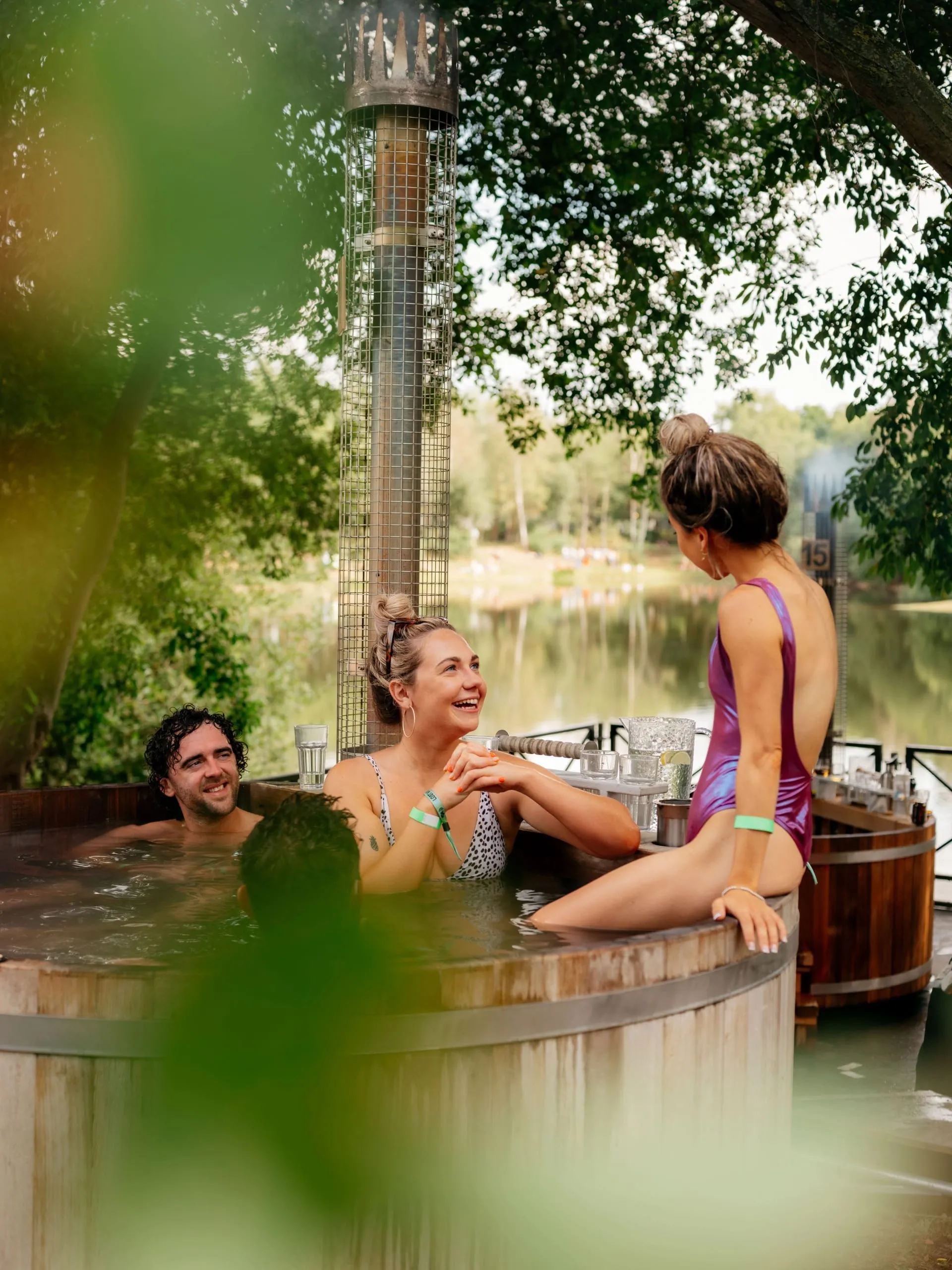 people relaxing at the outdoor spa